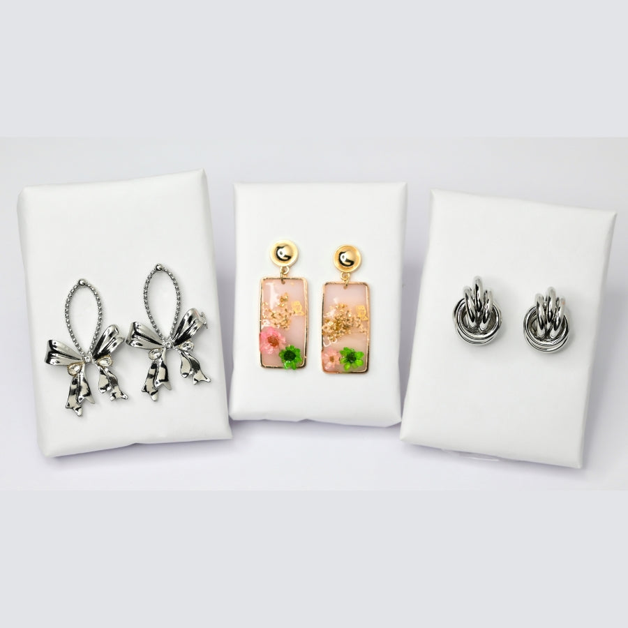 Elegant Earring Set – Silver Bow, Floral Resin, & Classic Knot Hoops